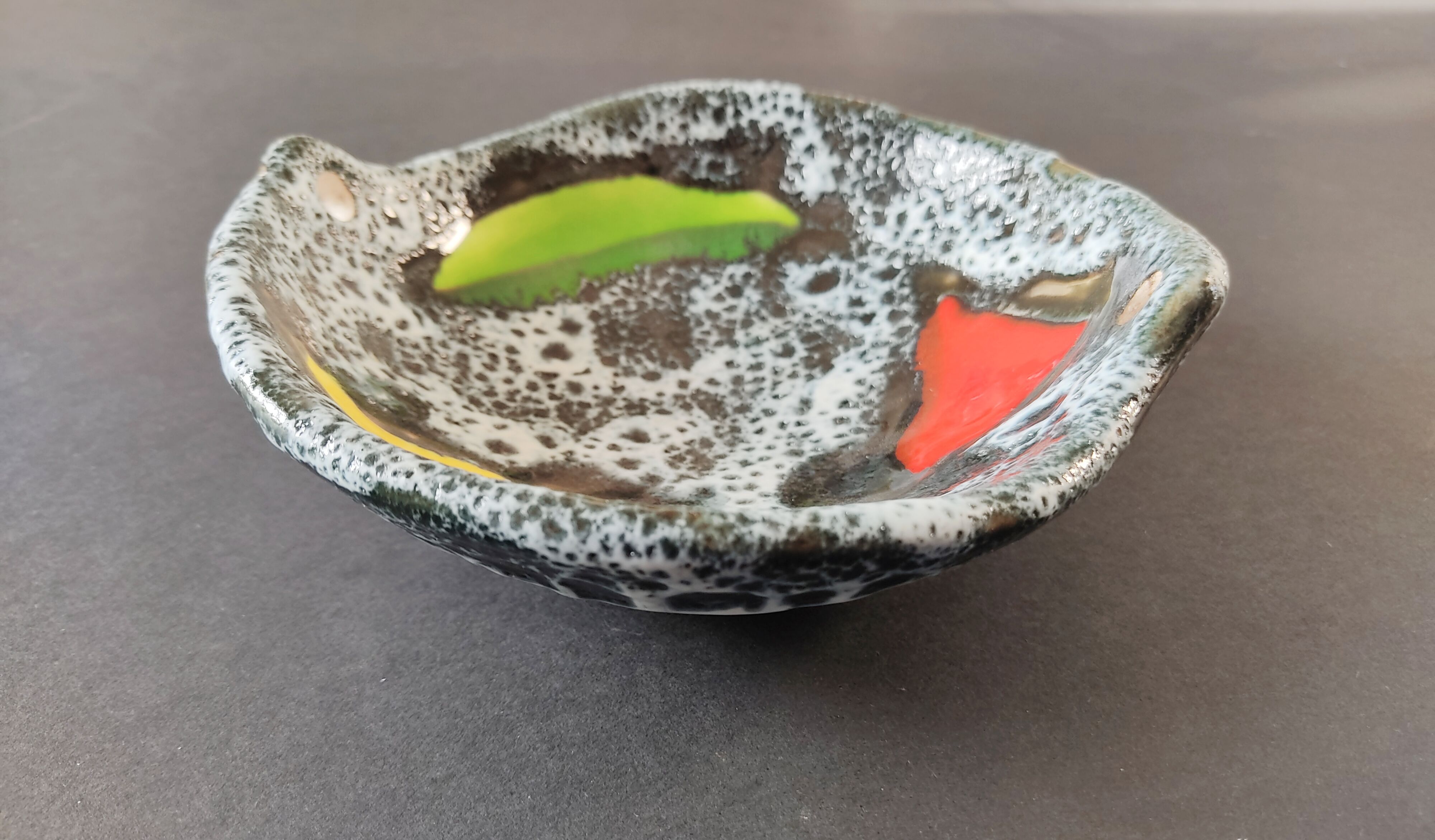 Empty black and white pocket with colored enamels