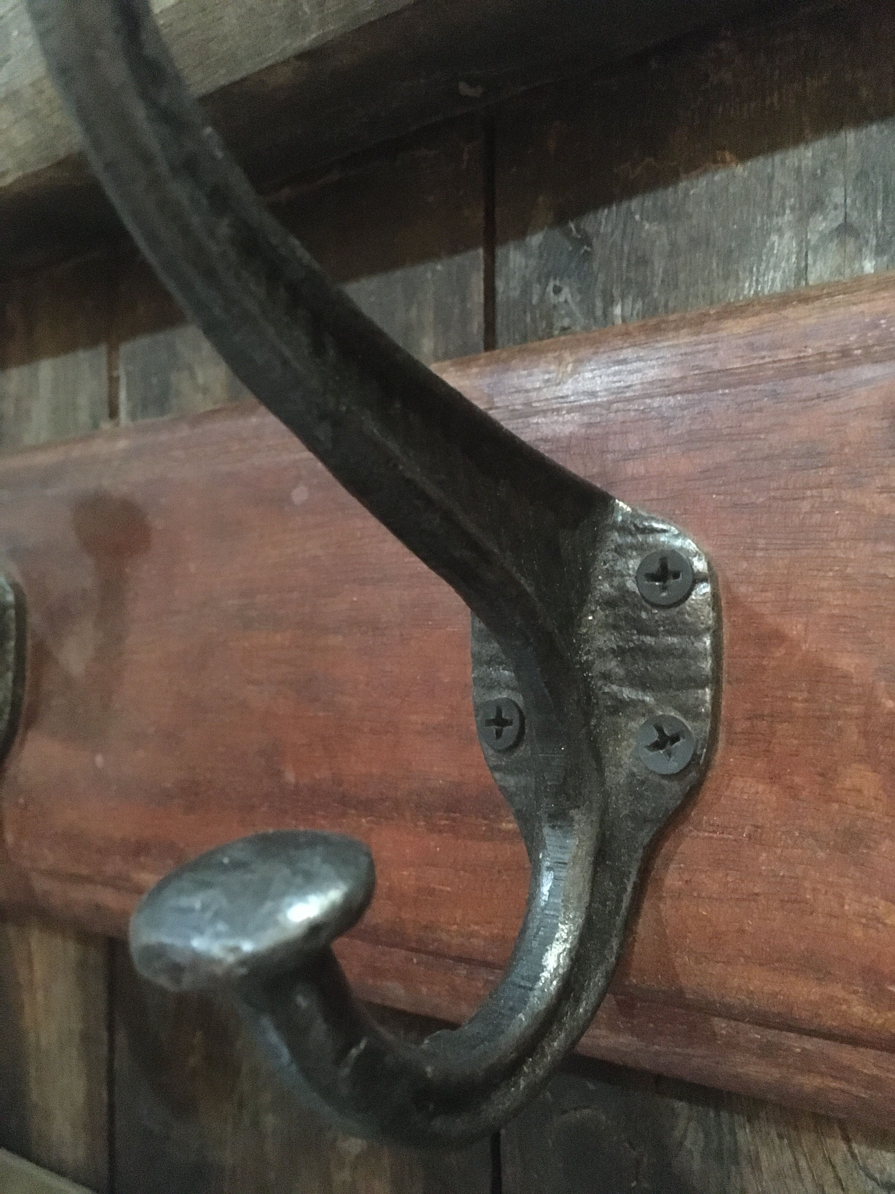 Metal patère on wood