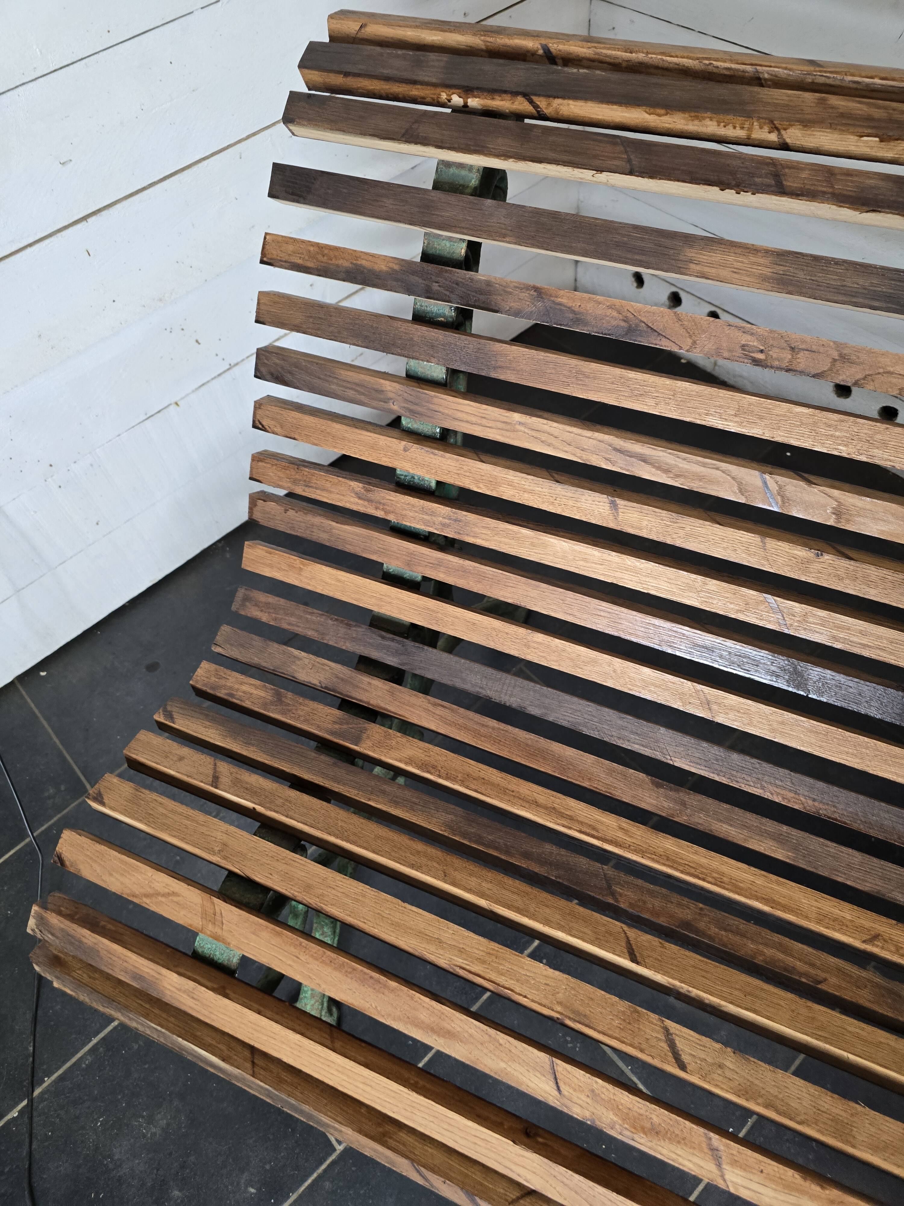 Old cast iron garden bench with oak slats