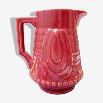 Burgundy/red ceramic pitcher