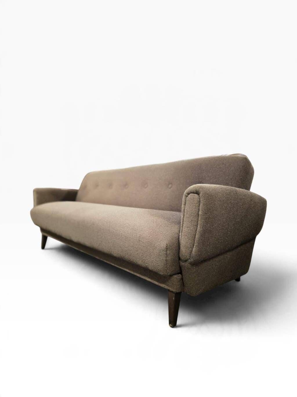 Vintage armchair/sofa/lounge in taupe colour with a stain.