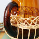 Amber glass decanter dressed in wicker, vintage