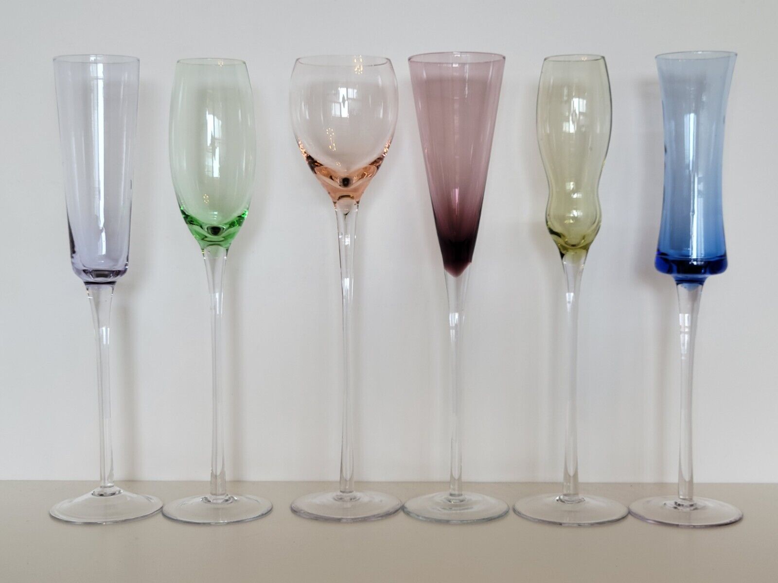 Set of 6 champagne flutes in different colors and shapes