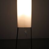 Mid-century modern floor lamp on iron legs with plastic shade and wood accent