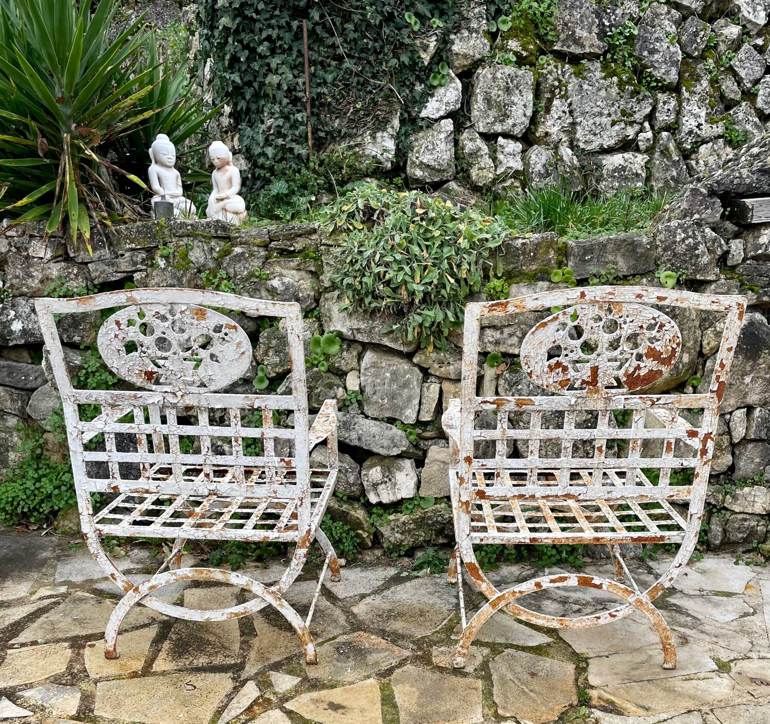 Pair of wrought iron armchairs