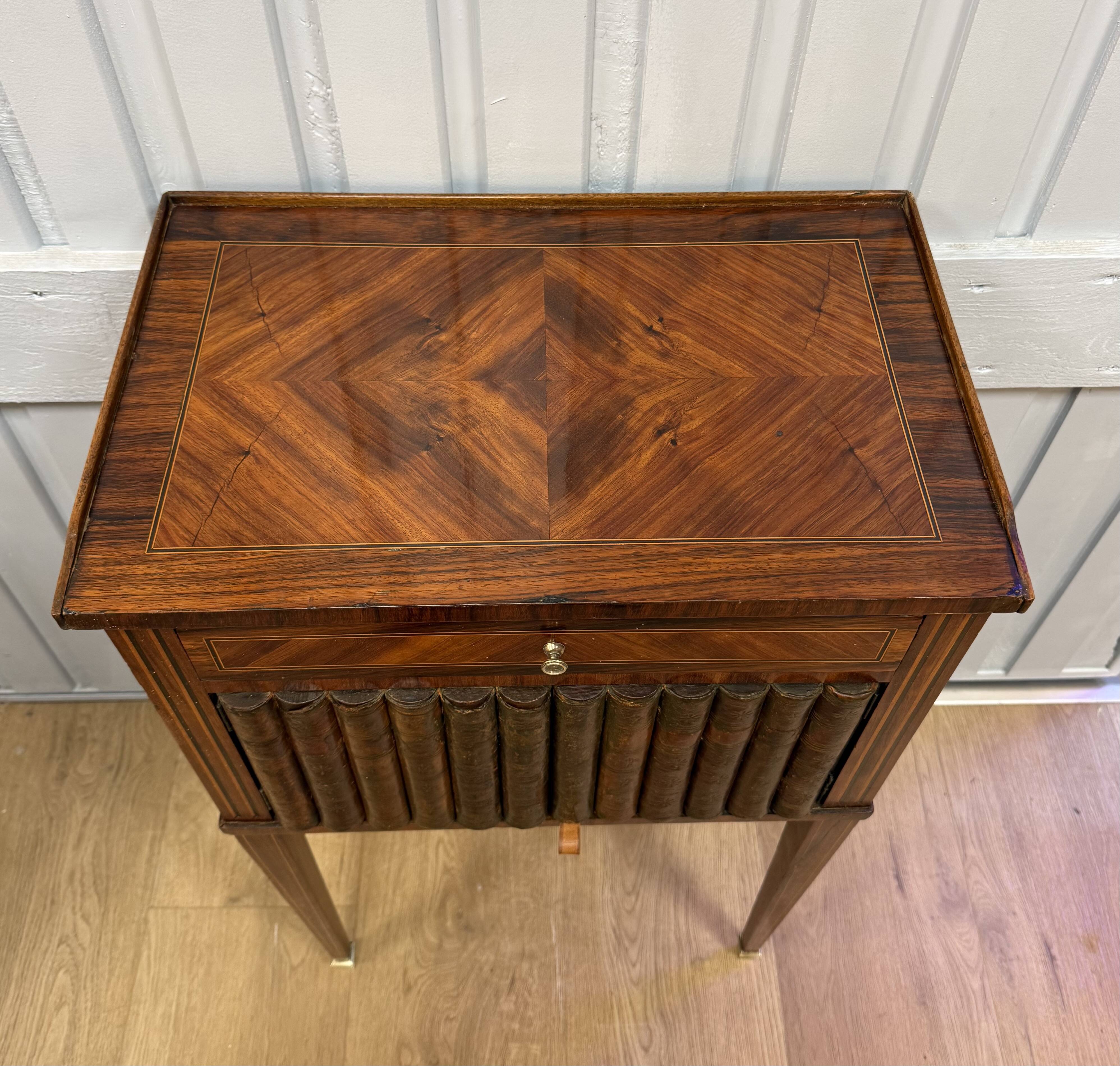Side table with a faux book front.