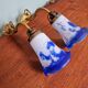 Pair of wall lights in bronze and marmoreal glass