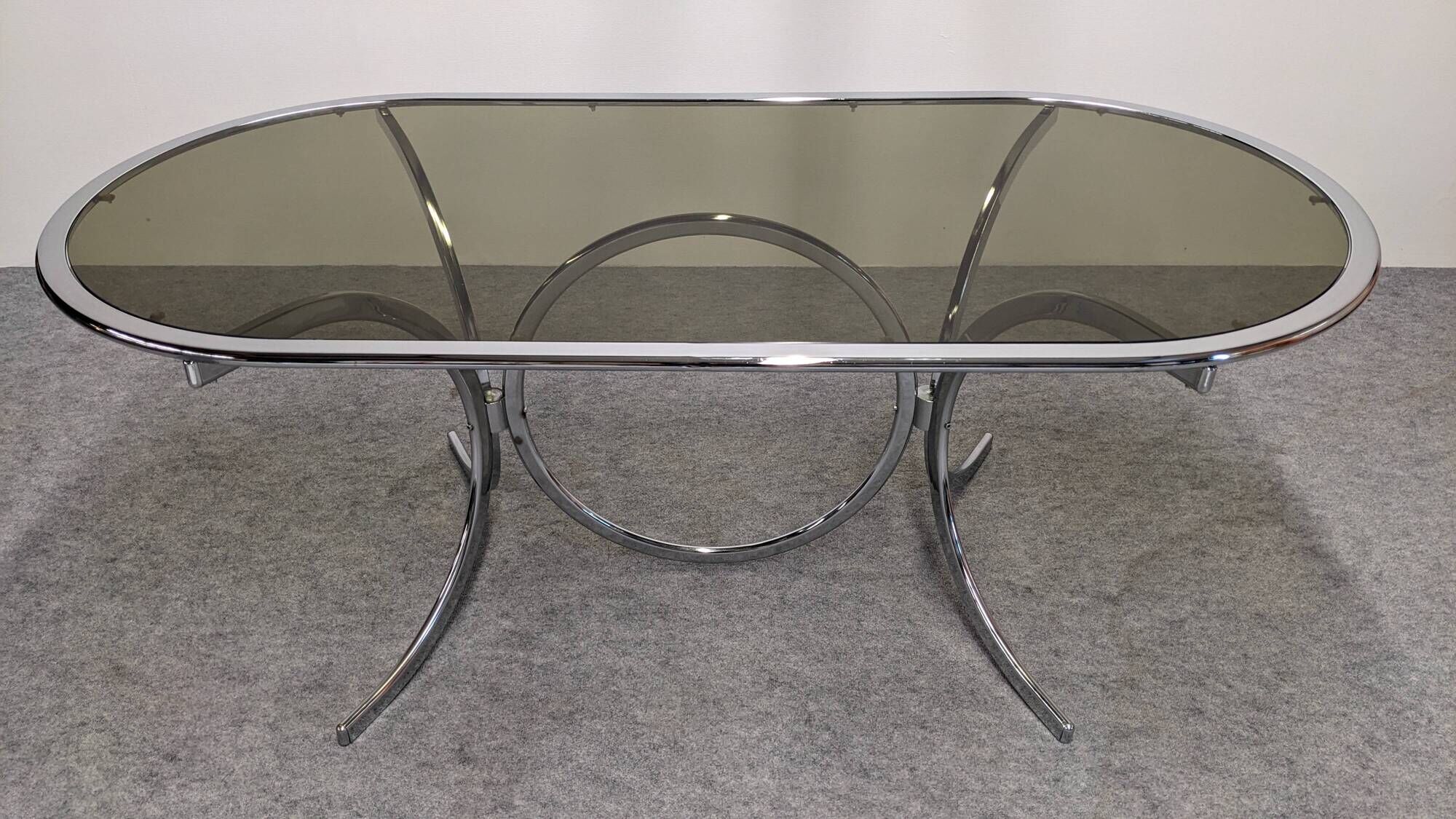 Oval dining table in chromed metal and smoked glass, Italy circa 1970
