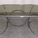 Oval dining table in chromed metal and smoked glass, Italy circa 1970