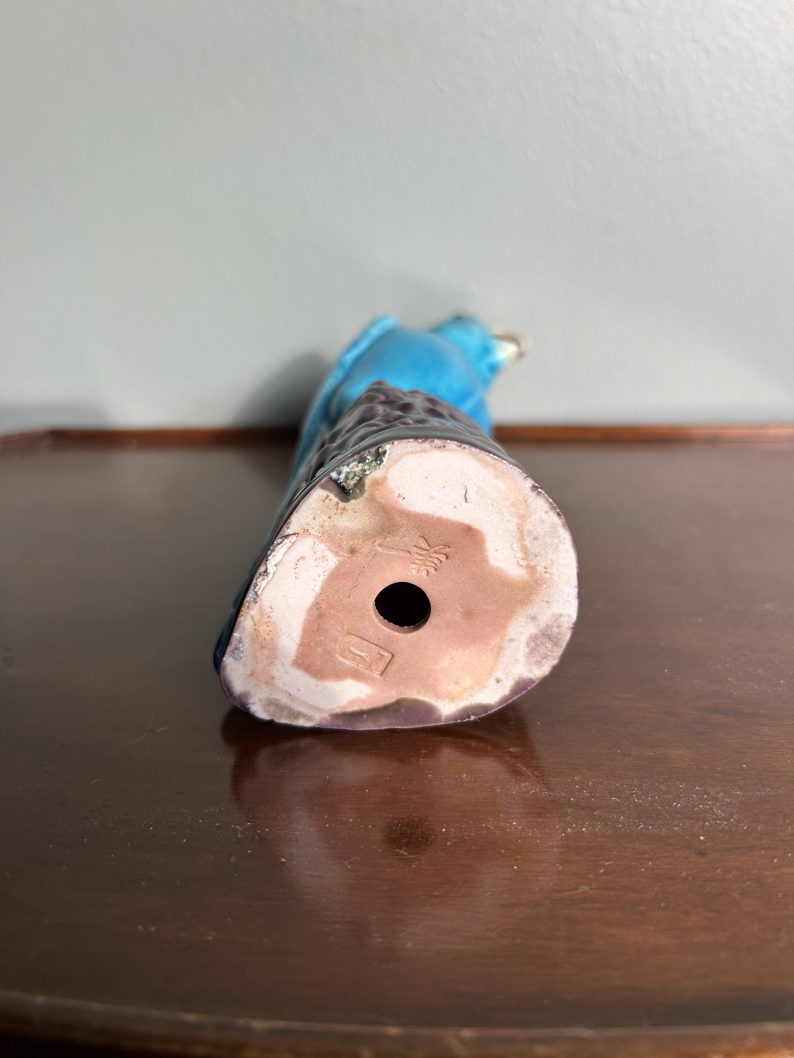 Porcelain parrot statuette