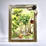 Vintage wall mirror in varnished steel decorated with a rose in relief