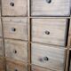 Industrial or apothecary workbench with 30 vintage wooden drawers.