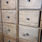 Industrial or apothecary workbench with 30 vintage wooden drawers.