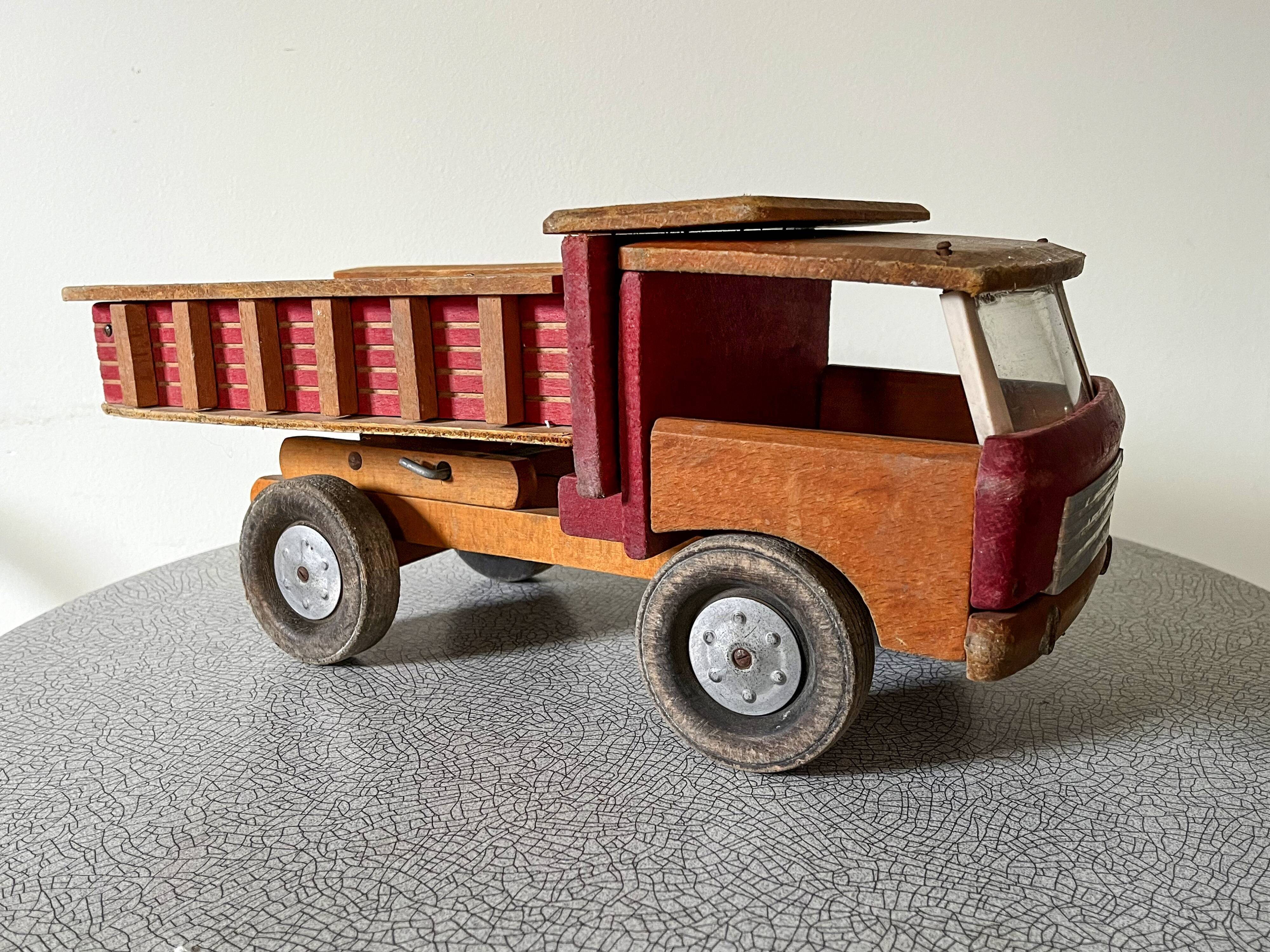 Wooden dump truck from the famous french brand dejou
