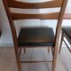 5 Scandinavian style chairs, wood and black faux leather.