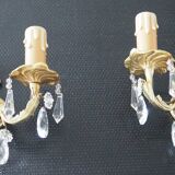 Pair of gilded bronze sconces and crystal pendants