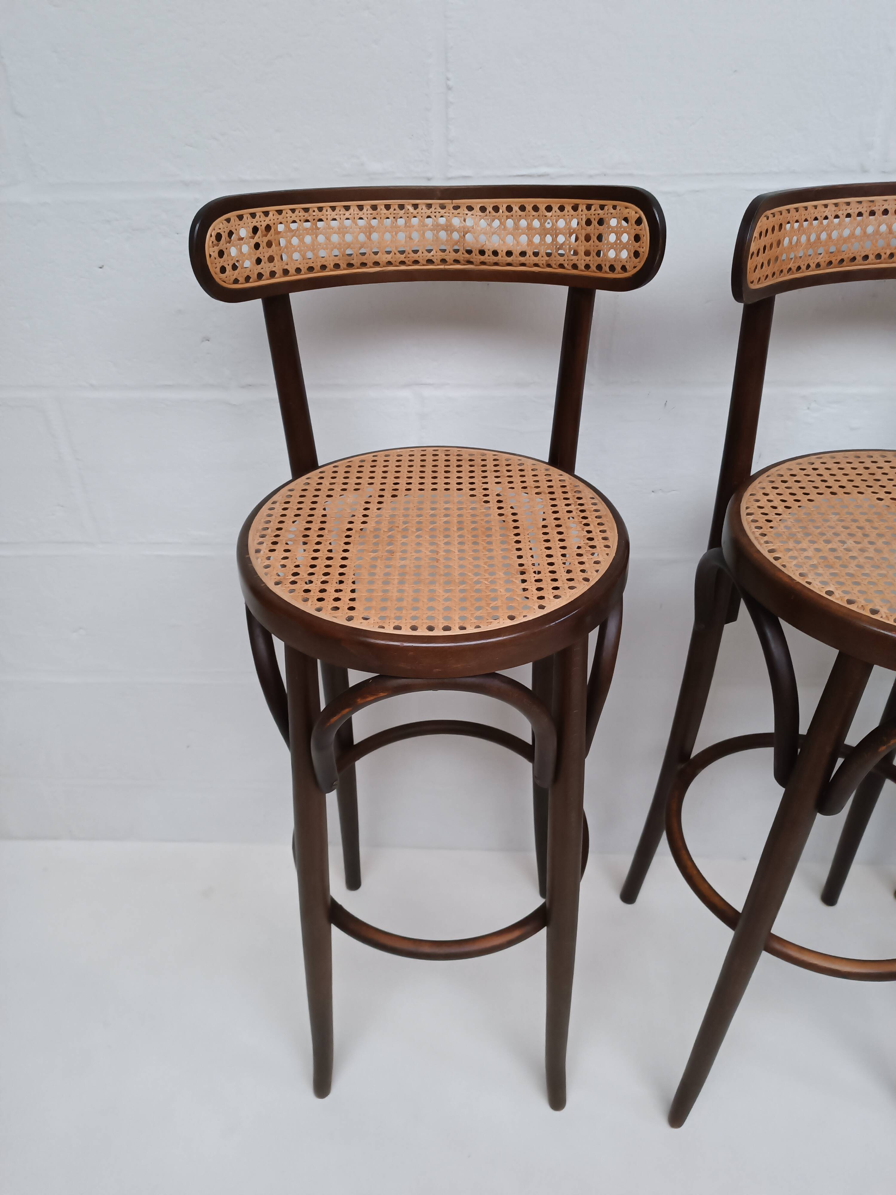 4 curved wood and cane bar stools