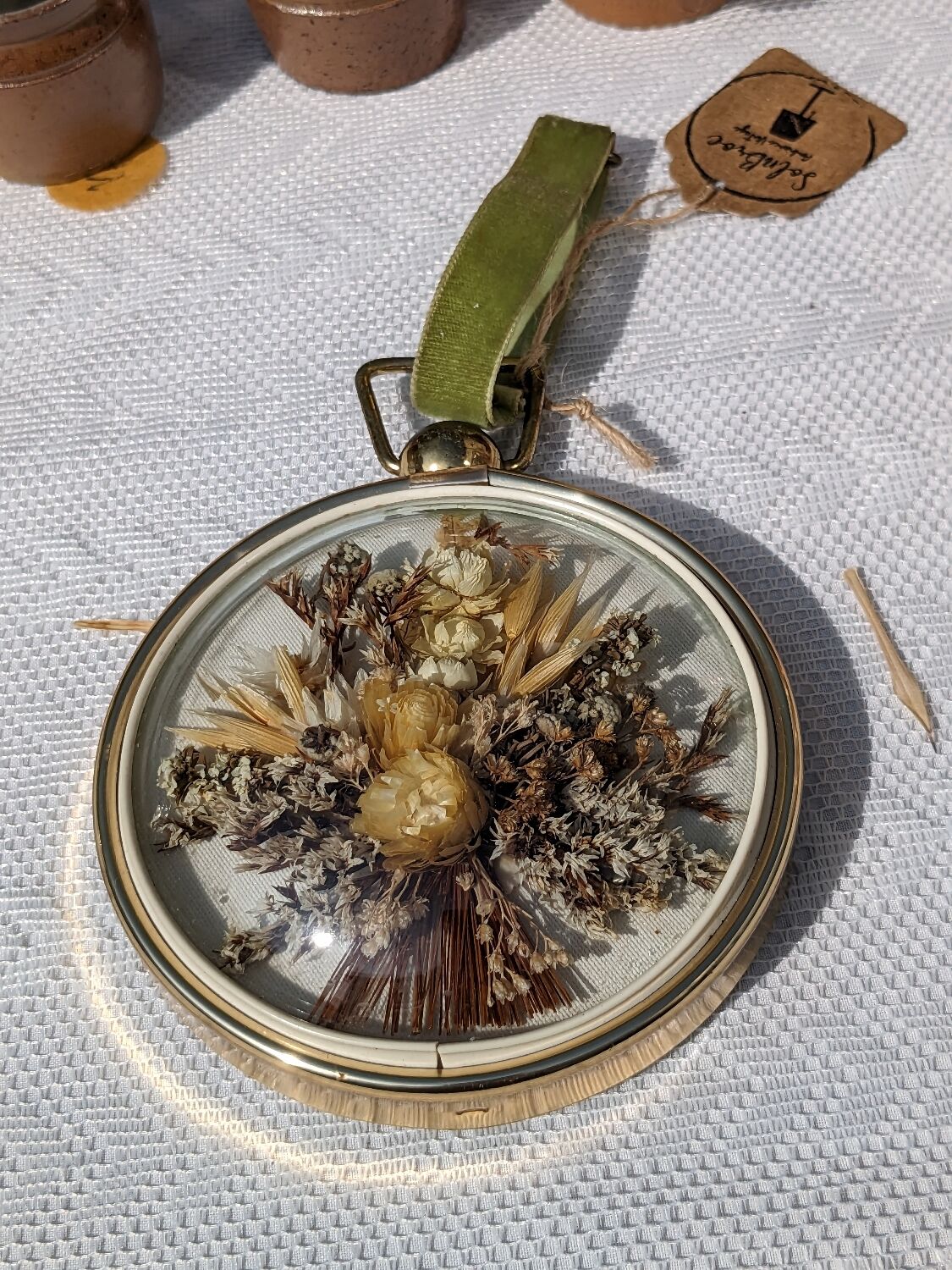 Domed frame of dried flowers