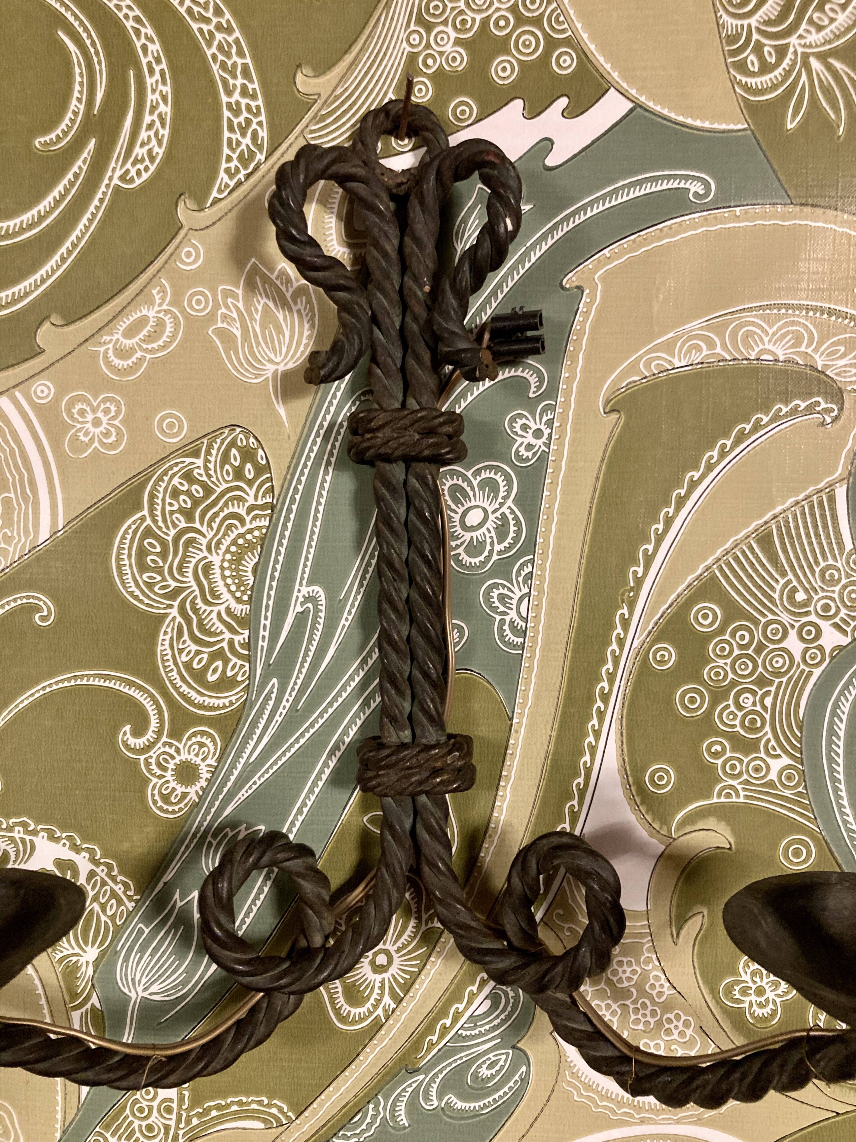 Pair of corded wrought iron wall lights