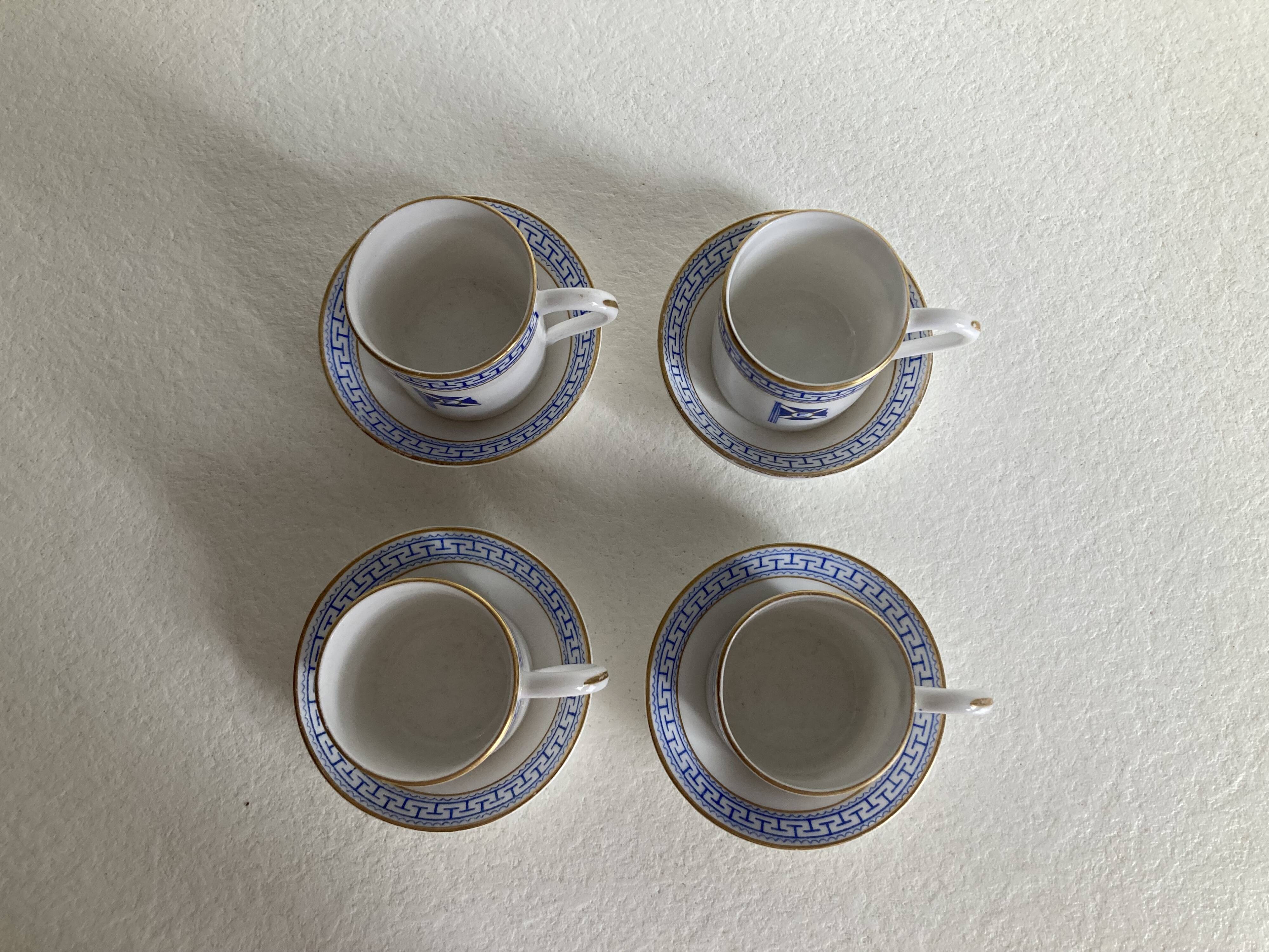 4 coffee cups and saucers