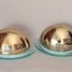 Pair of gold metal and plexiglass wall lights, circa 1980.