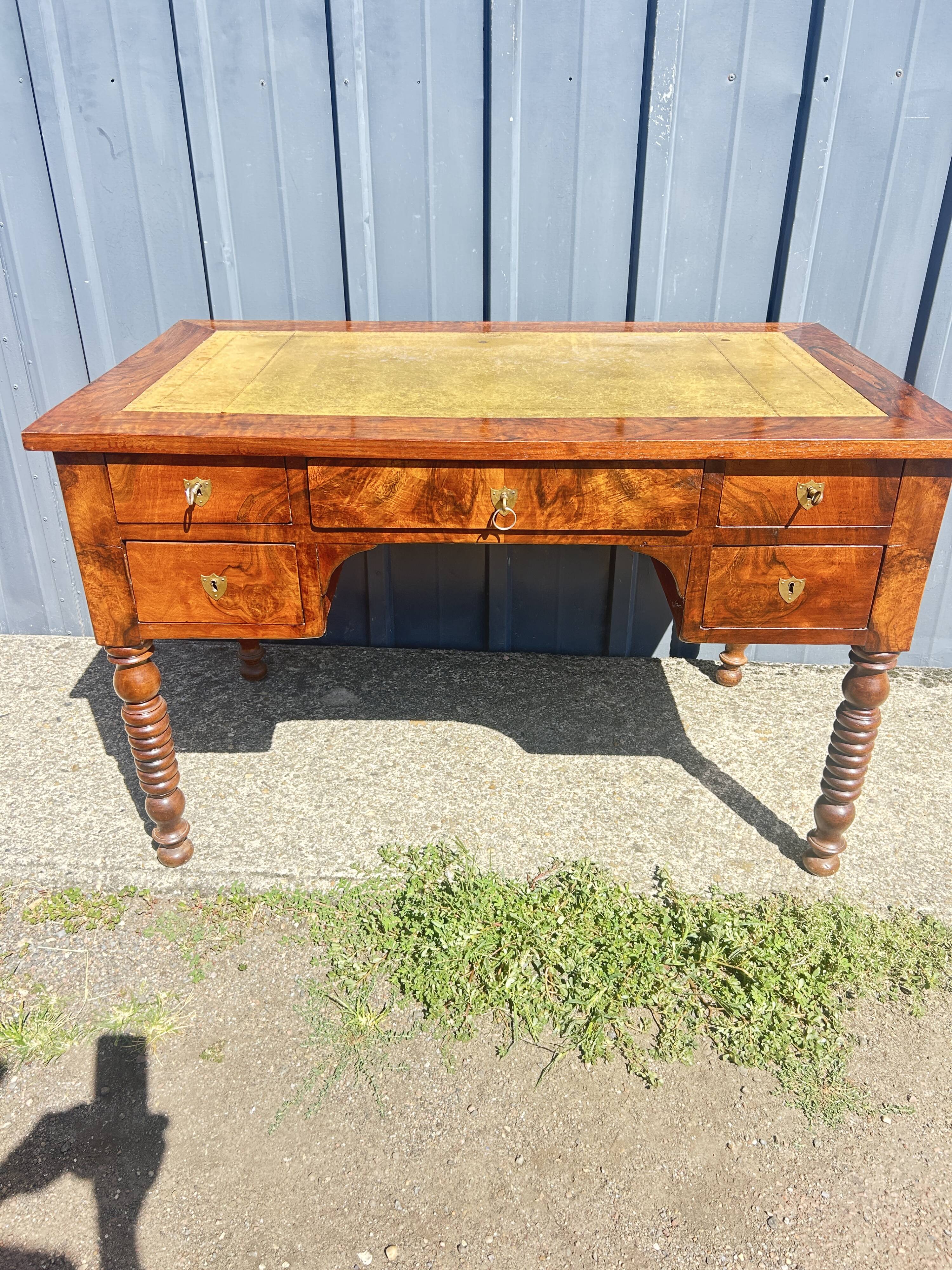 Louis Philippe desk in walnut, with a leather top.