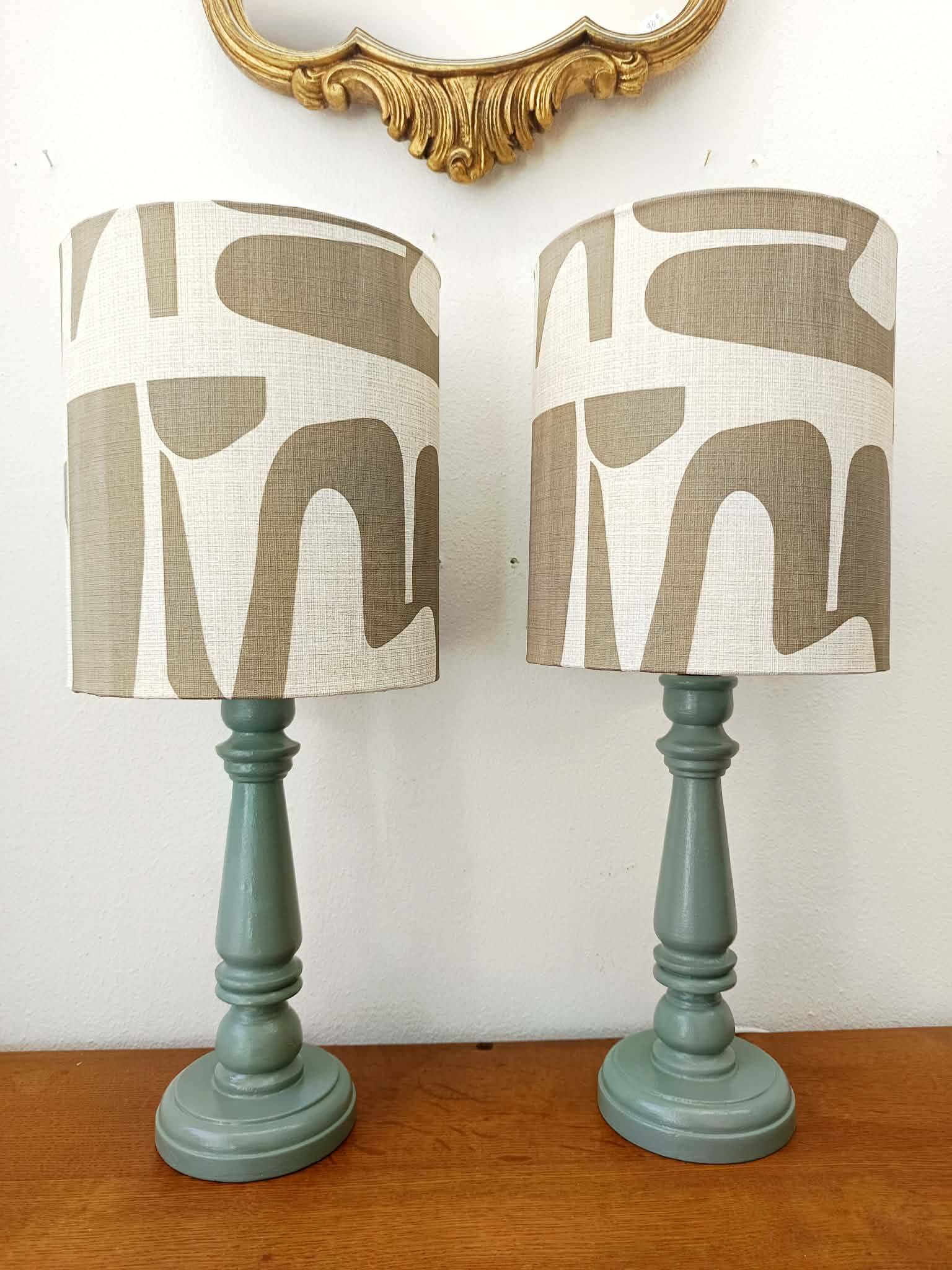Pair of wooden lamps with custom modernist lampshades.