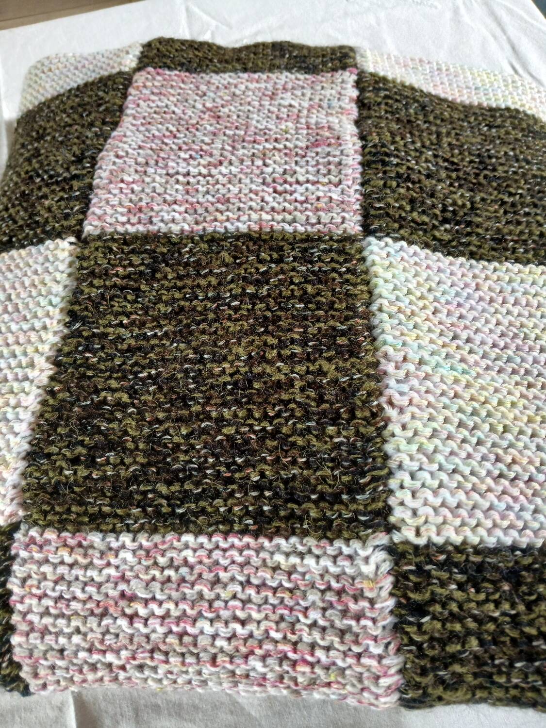 Hand-knitted patchwork plaid