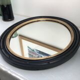 black and gold oval mirror