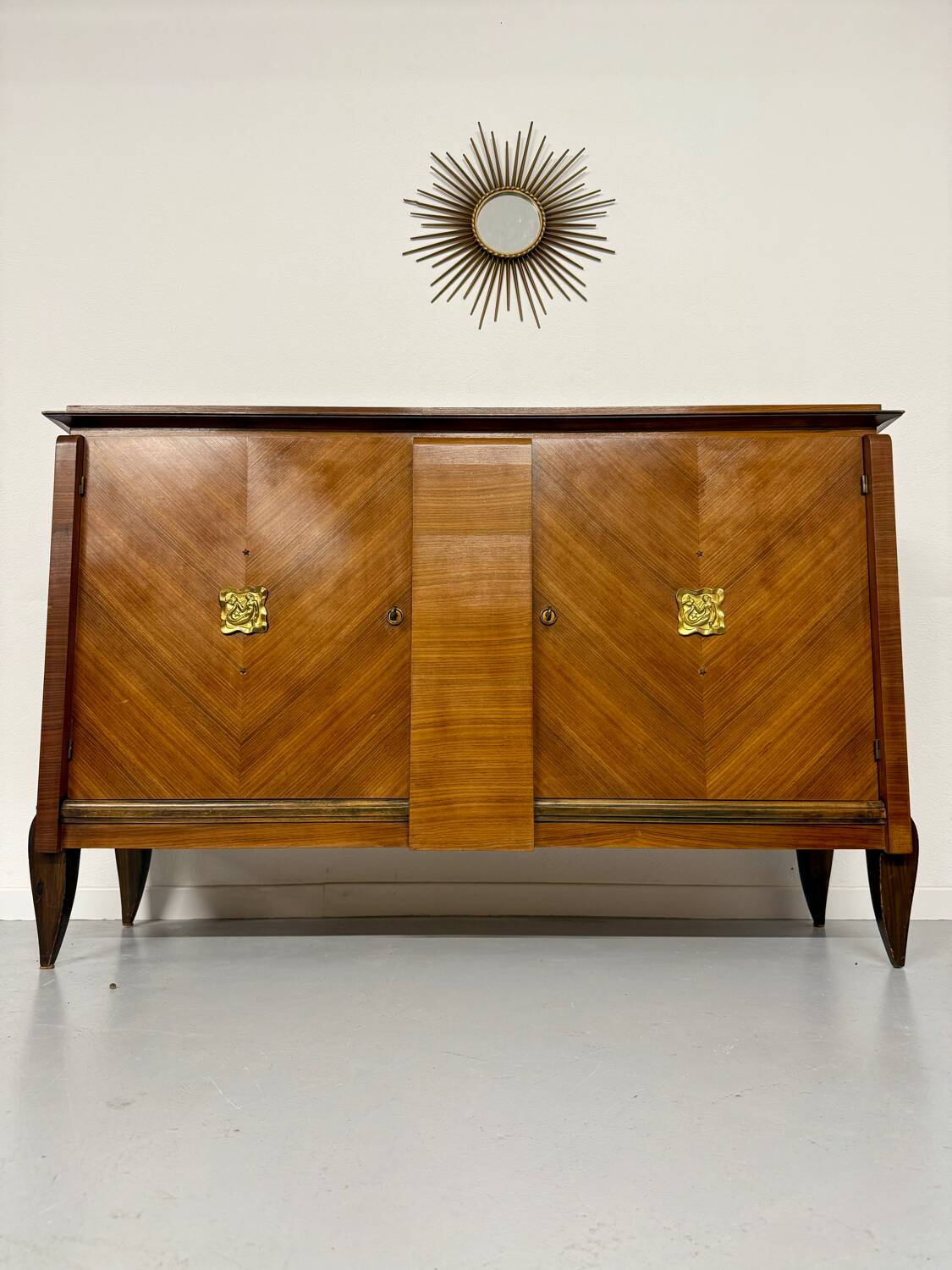 Antique art deco sideboard from the 1930s with veneered wood and bronze insert