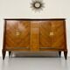 Antique art deco sideboard from the 1930s with veneered wood and bronze insert