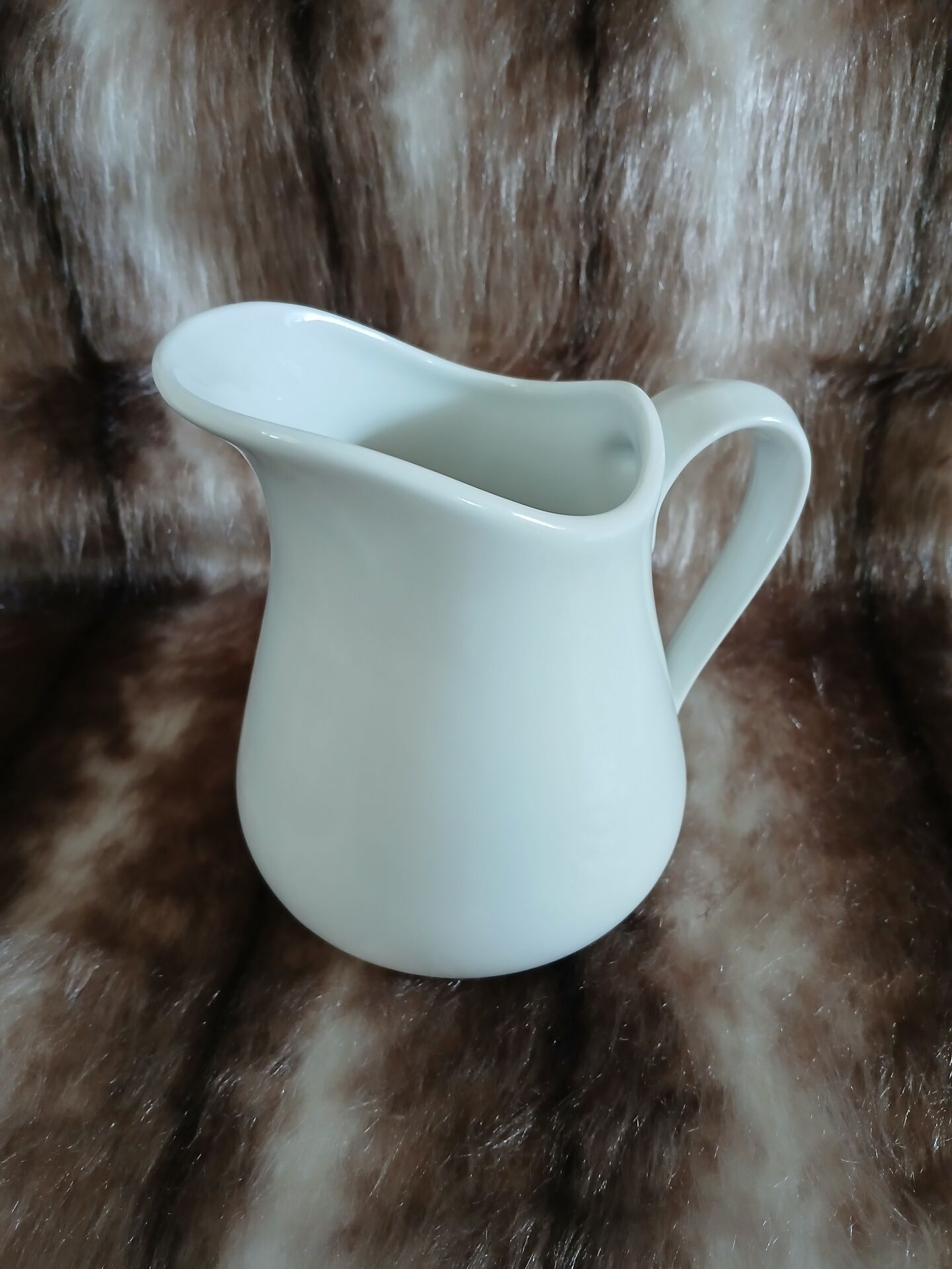 2 antique pitchers in white earthenware