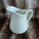 2 antique pitchers in white earthenware