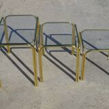 Nesting tables in gold-tone metal and glass