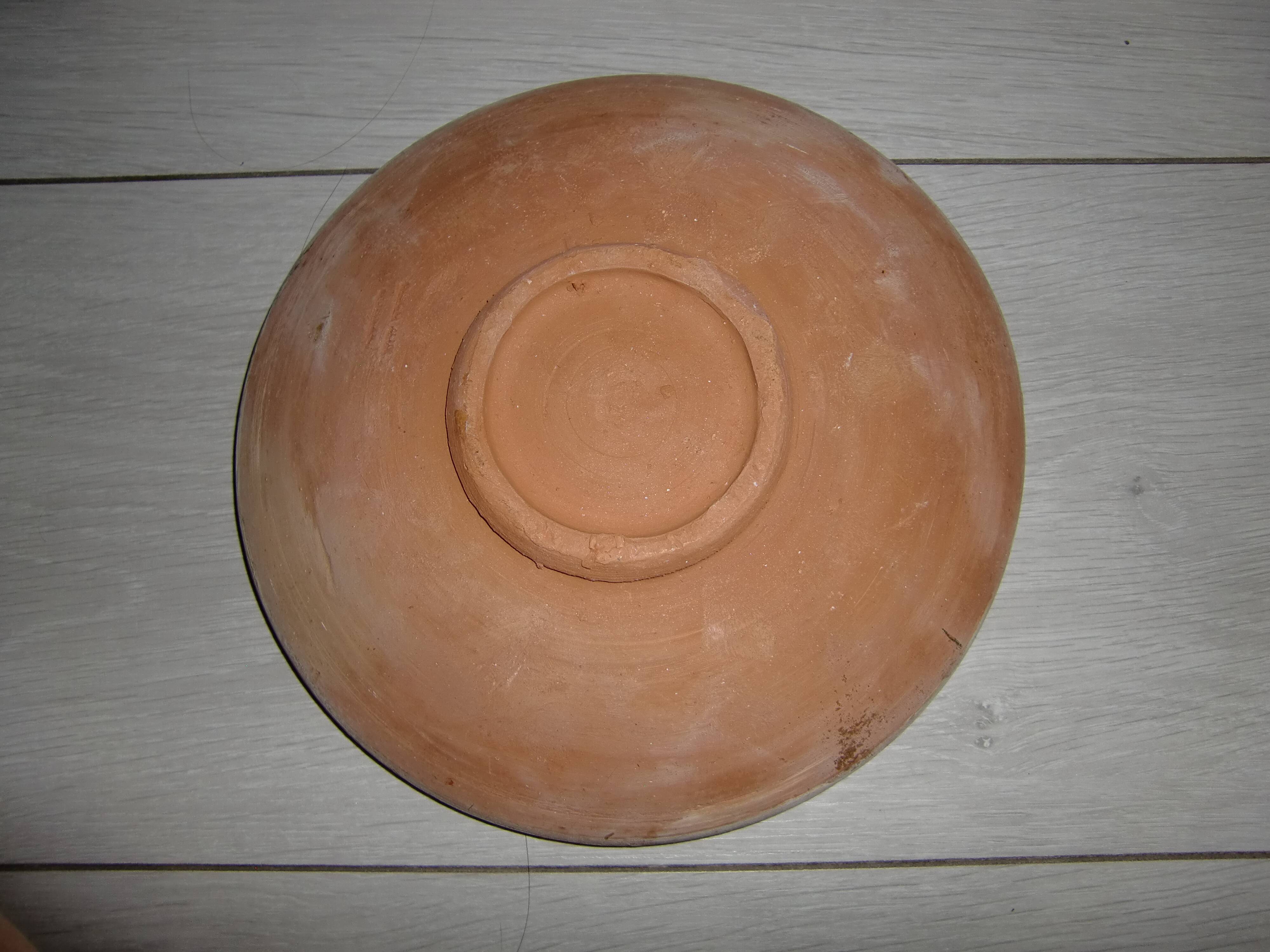 Hand decorated terracotta plate