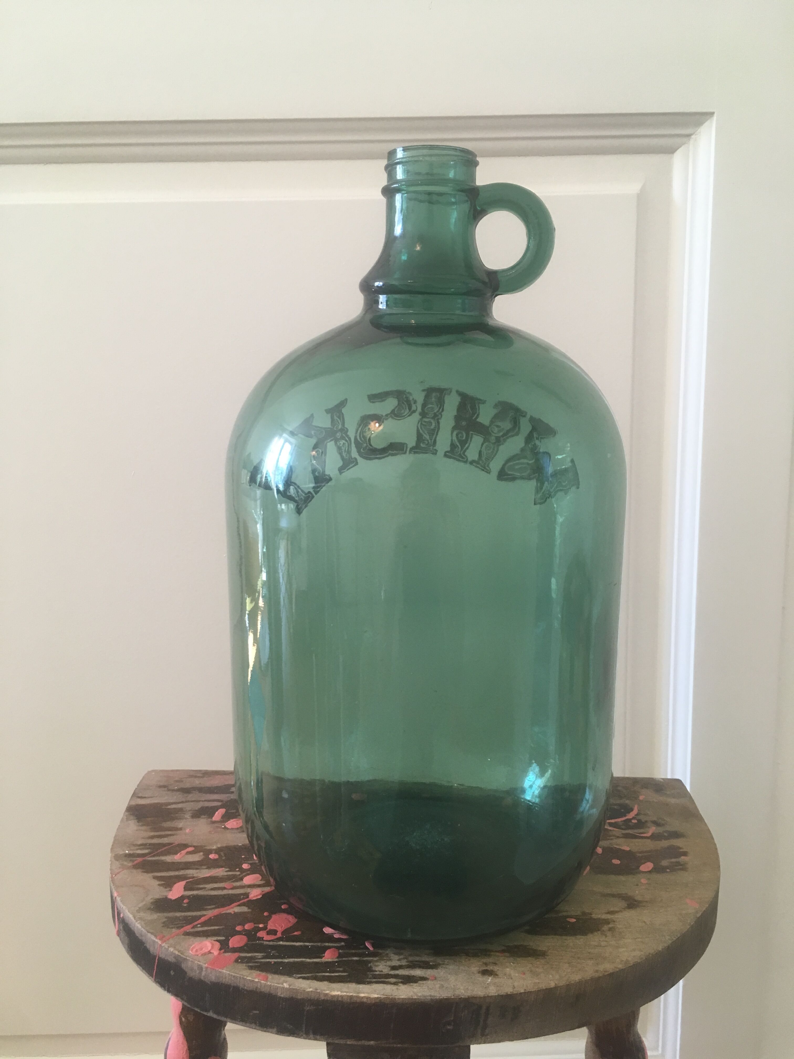 Green glass whiskey bottle