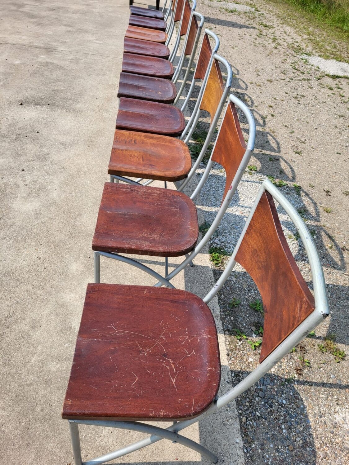 Set of 10 tubular oak bistro dining chairs in vintage industrial style.