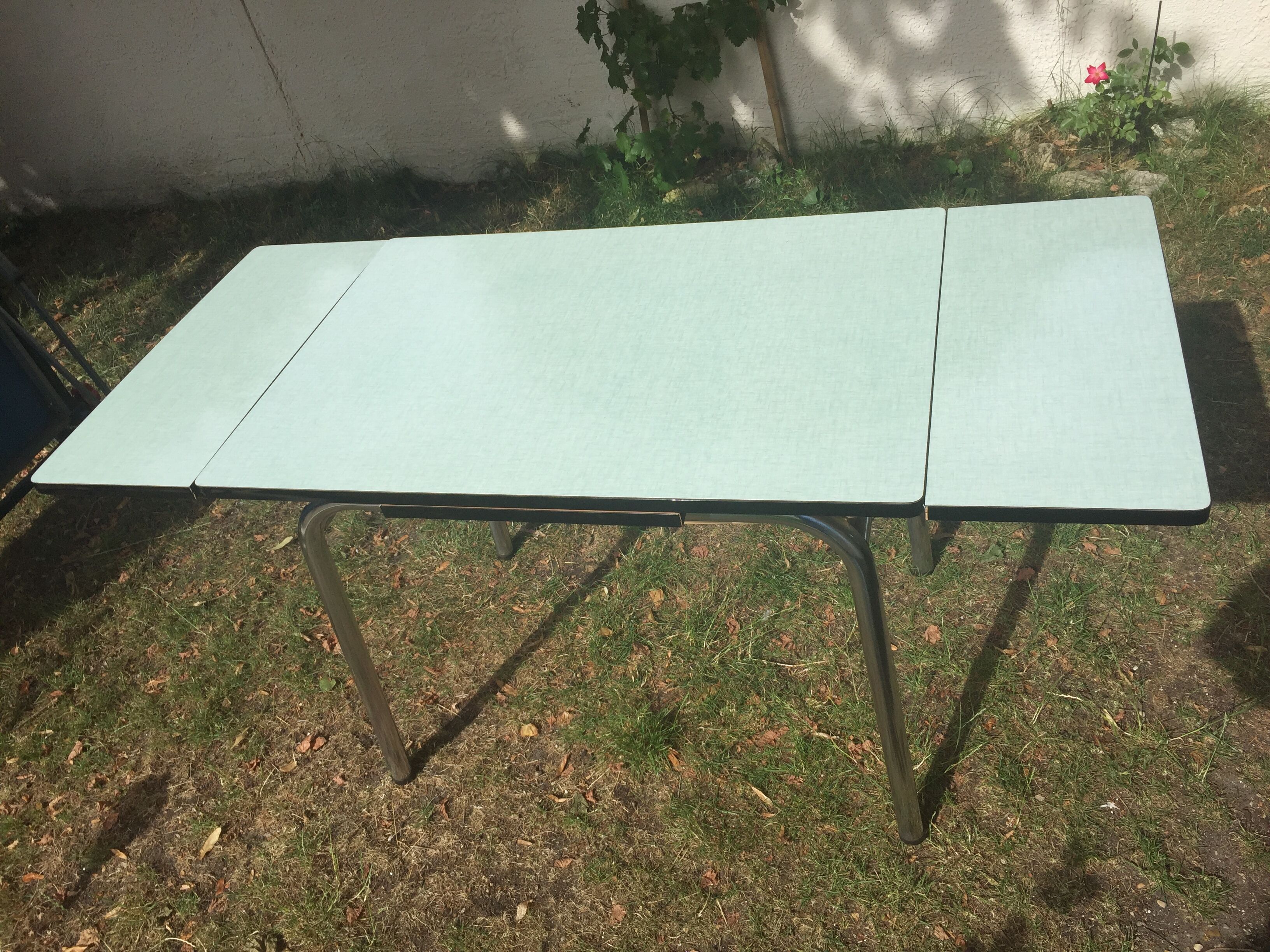 Table and 4 green water formica chairs 60's