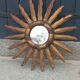 Miroir soleil en bois et stuc doré, années 50