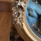 Oval gold mirror