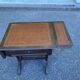 Small drop-leaf side table in English style with leather top & drawer.