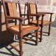 Pair of oak armchairs with straw seats and backs.