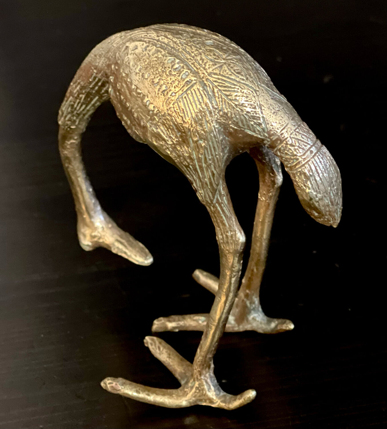 Heron in brass.