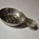 Antique silver-plated metal tastevin with tavern scene decor and shell handle