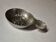 Antique silver-plated metal tastevin with tavern scene decor and shell handle