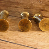 Trio of brass candle holders