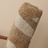 Pair of vintage lounge chairs in brown jacquard fabric and wood.