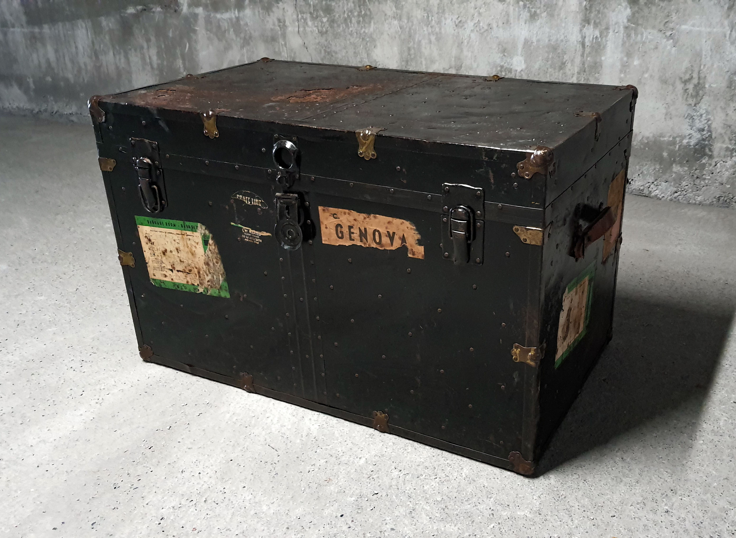 Riveted metal travel trunk