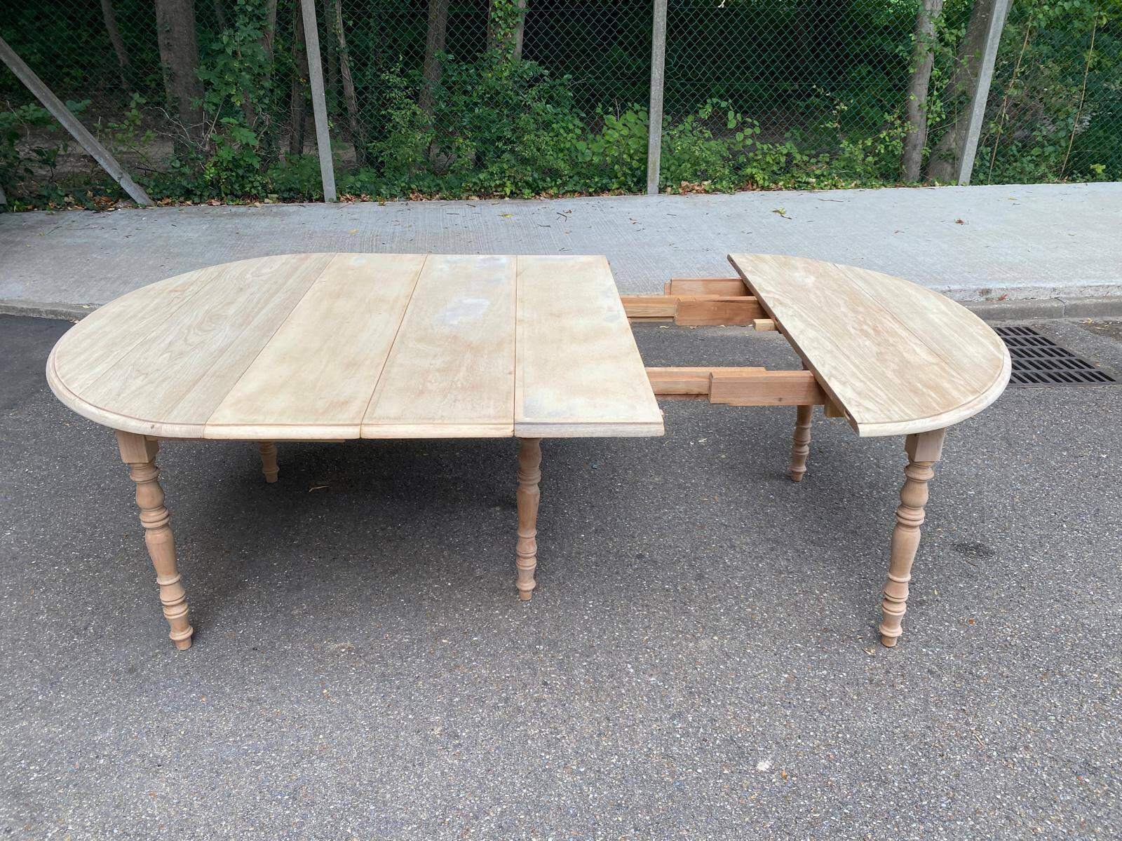 Renovated Louis Philippe round extendable dining table with flaps and 3 extensions.