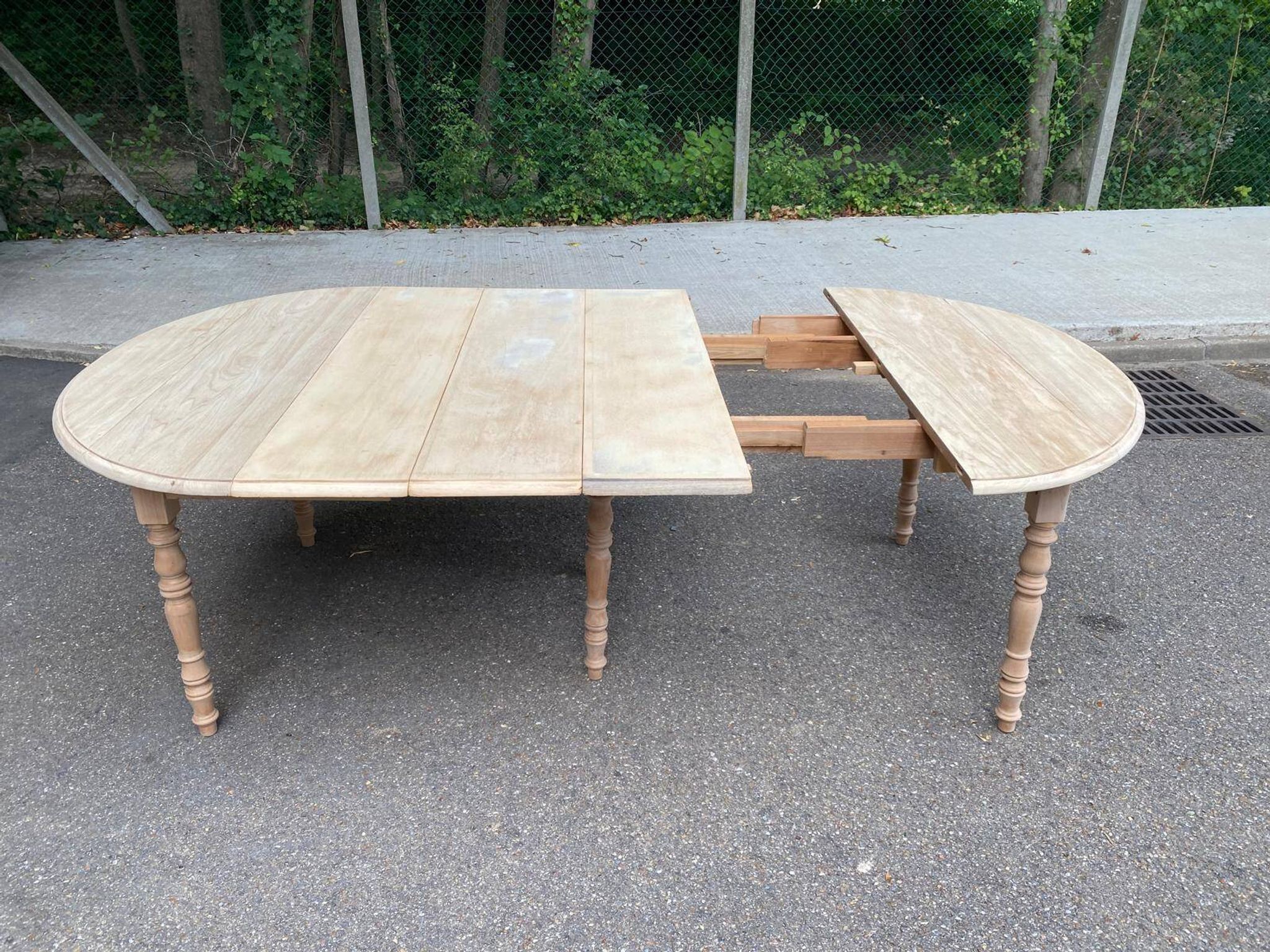 Renovated Louis Philippe round extendable dining table with flaps and 3 extensions.